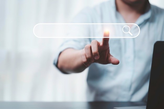 Hand touching with search icon for search engine optimisation or seo concept to find information by internet connection